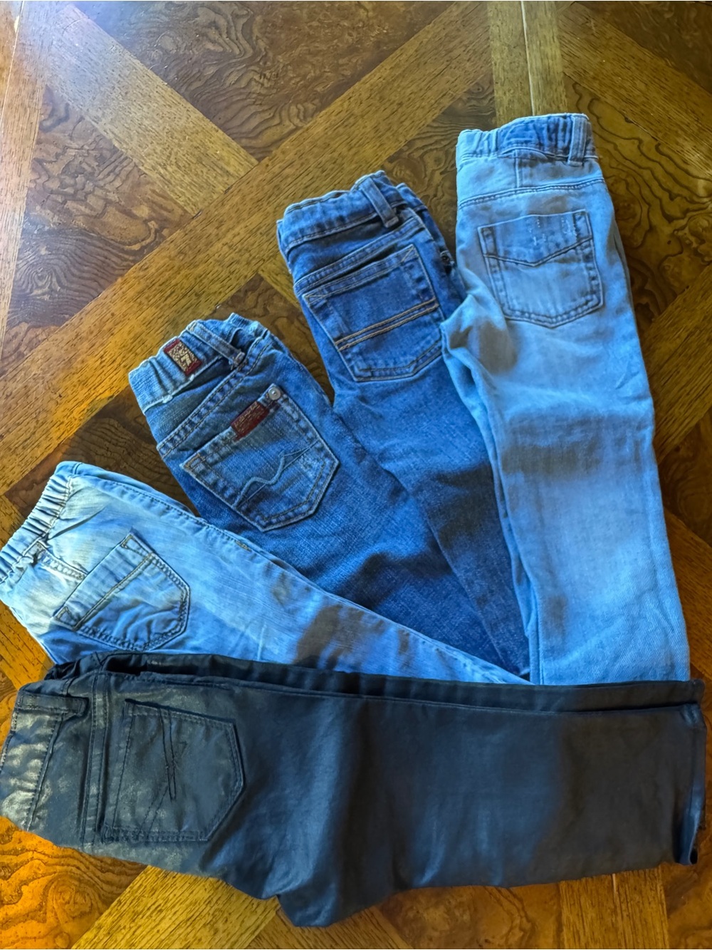 Bundle of five kids’ jeans - Diesel, 7 for all mankind, Gap, H&M, and Carter’s.